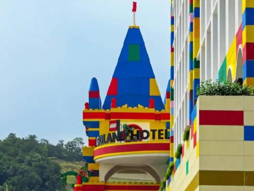 a colorful building in front of a building at Almas Puteri Harbour Suite Johor Bahru Cosy Room 5 min to Legoaland Medini near 2nd Link by HomeSpace in Iskandar Puteri