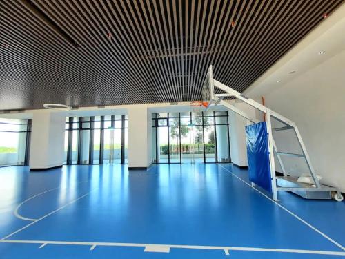 a gym with a basketball hoop in a building at Almas Puteri Harbour Suite Johor Bahru Cosy Room 5 min to Legoaland Medini near 2nd Link by HomeSpace in Iskandar Puteri