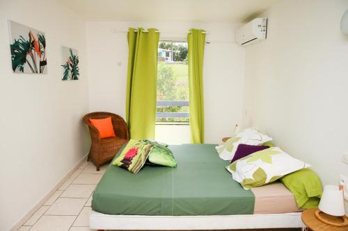 Ένα ή περισσότερα κρεβάτια σε δωμάτιο στο L'Or des Caraibes