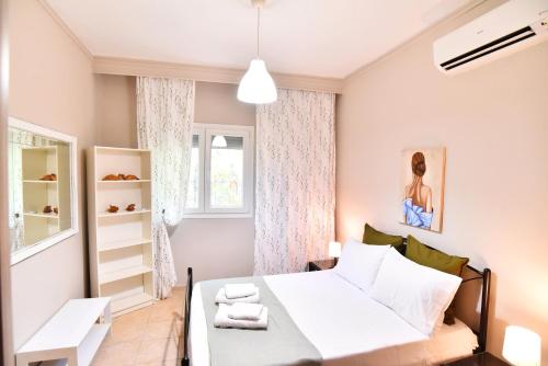 Ένα ή περισσότερα κρεβάτια σε δωμάτιο στο Adam's Villa