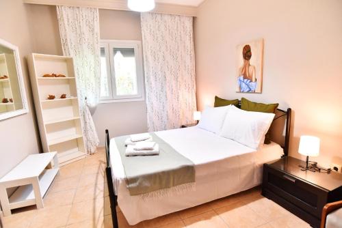 Ένα ή περισσότερα κρεβάτια σε δωμάτιο στο Adam's Villa