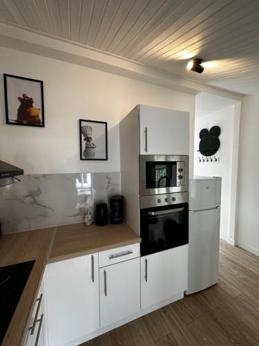 Køkken eller tekøkken på Maison décoration Disney à 10 min du Parc