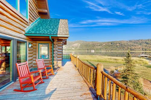 a deck with two chairs on a house at Waterfront Ranch on Pend Oreille in Sagle