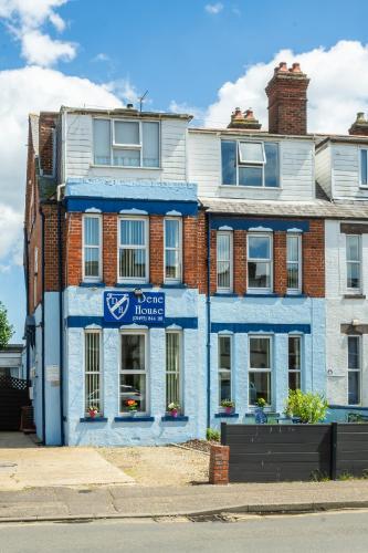 a blue brick building with a blue house at Dene House in Great Yarmouth
