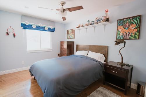 a bedroom with a bed and a ceiling fan at Serene Vineyard Chateau with Pool, Hot Tub, BBQ in Carmel Valley