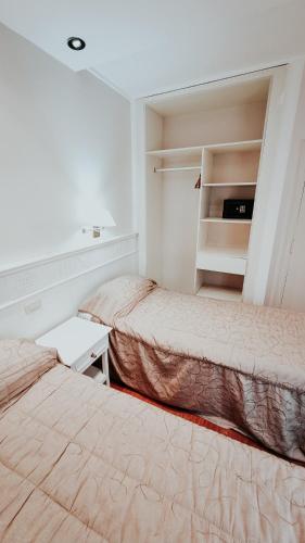 Postel nebo postele na pokoji v ubytování Hotel Punta del Este