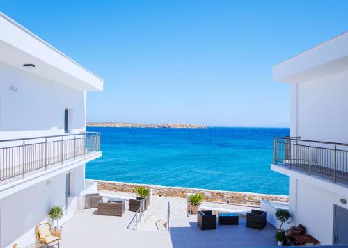 a view of the ocean from the balcony of a house at Blue Sea Paros in Drios