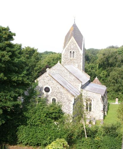 an old stone church in the middle of the forest at Sam's Stable in Bungay