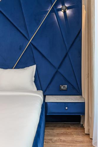 Voodi või voodid majutusasutuse KOA - Aparthotel toas