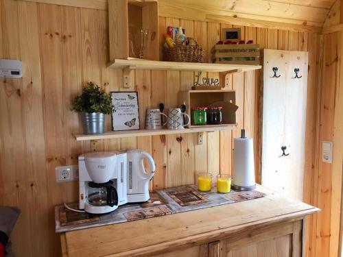 a kitchen with a coffee maker on a counter at Bauwagen Refugium in Hörnitz