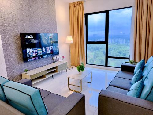 a living room with a couch and a tv at MidValley Southkey Mosaic 6-9pax Netflix-SmartTV70inch in Johor Bahru