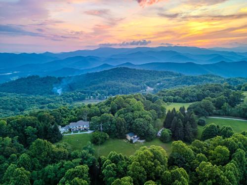 an aerial view of a house in the middle of a forest at Fire Mountain in Highlands