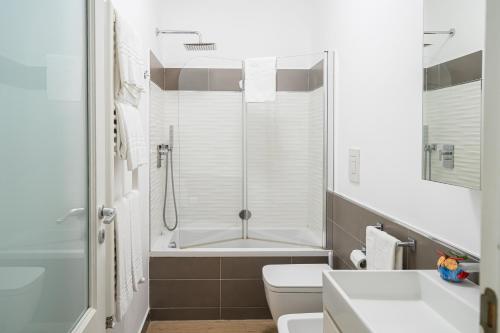 a bathroom with a shower and a toilet and a sink at Casa Stella in Vico Equense