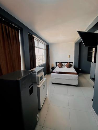 Postel nebo postele na pokoji v ubytování ESCALA BUSINESS HOTEL