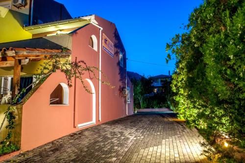 an empty street in front of a building at Pegasos Studios in Karavadhos