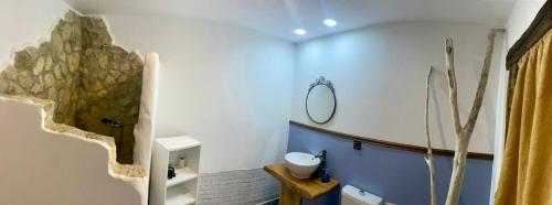 a bathroom with a sink and a mirror at Casa rural la grulla in Montmesa
