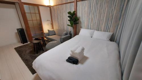 Una cama o camas en una habitación de サンドビレッジ