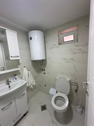 a bathroom with a toilet and a sink at Julia Apartments in Ohrid