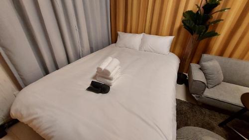 Una cama o camas en una habitación de サンドビレッジ
