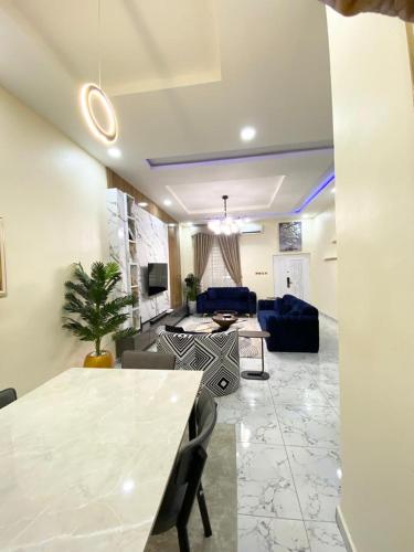 a living room with a table and a couch at Urban apartment in Lagos