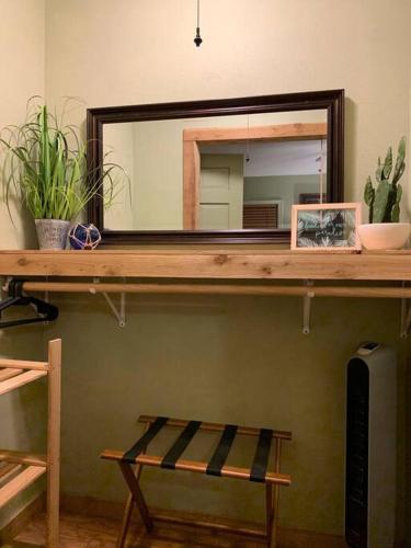 a mirror on top of a wooden shelf in a room at The River Haven - Sleeps 32 - on Guadalupe River in Seguin