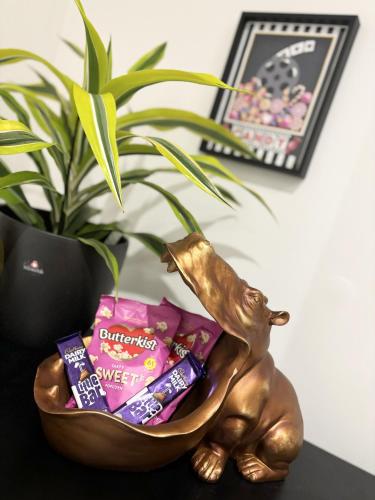 a statue of a rabbit in a bowl of candy at Modern two bed apartment in Hull