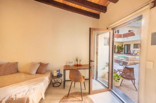 a living room with a couch and a table at Casa Victoria Malecón - Adults Only in Puerto Vallarta