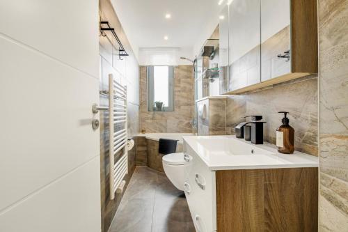 a bathroom with a sink and a toilet at VALLEY APARTMENT Wuppertal in Wuppertal