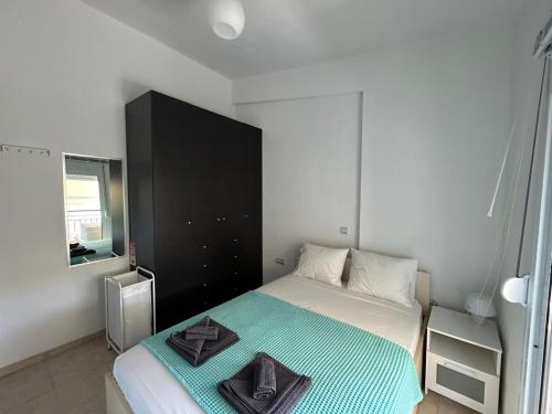 Ένα ή περισσότερα κρεβάτια σε δωμάτιο στο Karma Apartments