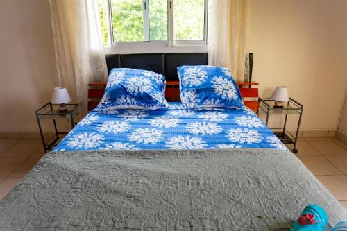 Llit o llits en una habitació de L'appartement PAPAYE