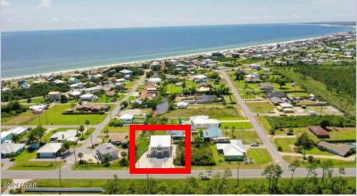 an aerial view of a suburb with a red rectangle at Emerald Coast Retreat 2 4person golf carts large swim spa included in Mexico Beach