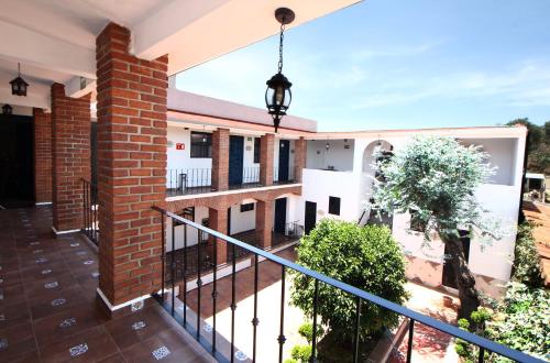 a balcony of a house with a brick building at Hotel Boutique Casa Téllez in Maboro