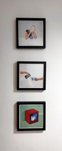 two framed pictures of a person on a wall at Viel Platz und Ruhe für 4 am Valentins-Park in Unterschleißheim