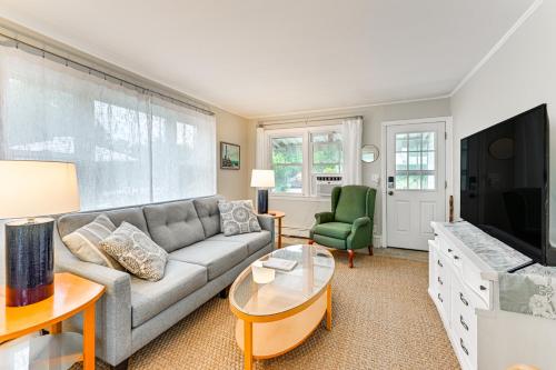 a living room with a couch and a tv at Bayfront East Quogue Retreat with Private Boat Dock in East Quogue