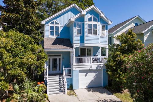 a blue and white house with a porch at Fripp Island 96 Davis Love Dr in Fripp Island