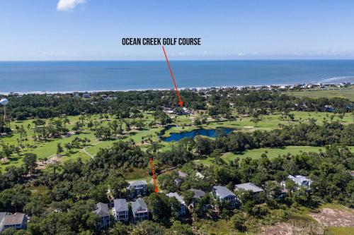 an aerial view of a golf course with the ocean in the background at Fripp Island 96 Davis Love Dr in Fripp Island