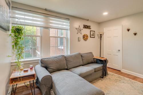 a living room with a couch and a window at Convenient Arlington Condo about 4 Mi to National Mall in Arlington
