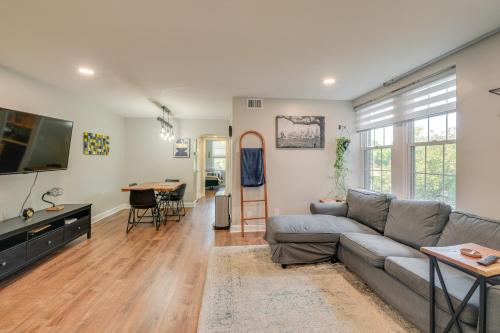 a living room with a couch and a table at Convenient Arlington Condo about 4 Mi to National Mall in Arlington