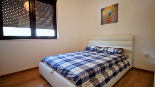 Ένα ή περισσότερα κρεβάτια σε δωμάτιο στο City Center Apartment Prova 2