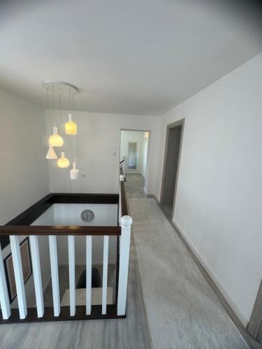 a hallway of a home with white walls and a staircase at Inn Nature in Pale