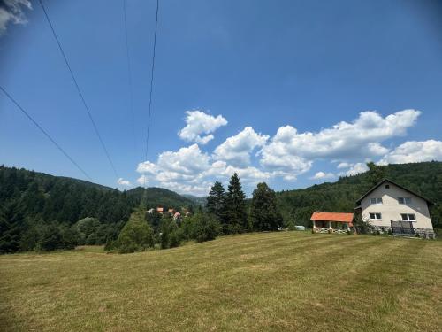 a large field with a house on top of it at Inn Nature in Pale