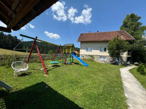 a playground in a yard with a house at Inn Nature in Pale
