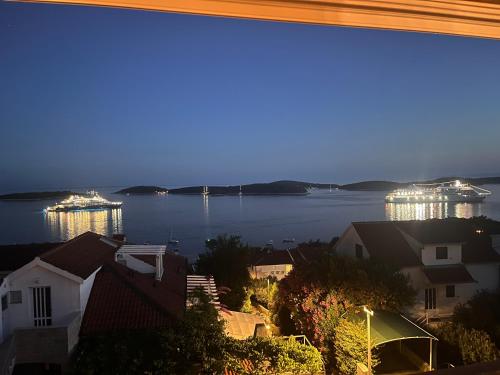 a view of a large body of water at night at Top View Residence in Hvar