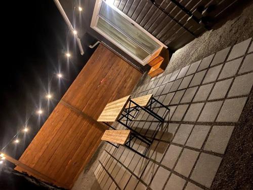 a group of benches sitting on the side of a building at Waterfront River Apartments in Rogue River