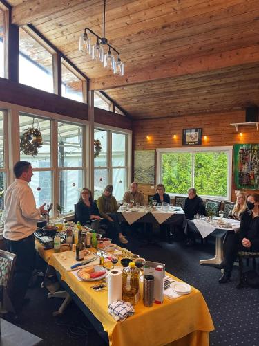 a group of people sitting at tables in a restaurant at Shannaghs Sweet Escape in Powell River