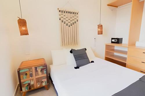 Ένα ή περισσότερα κρεβάτια σε δωμάτιο στο Cedro Departamentos Bacalar