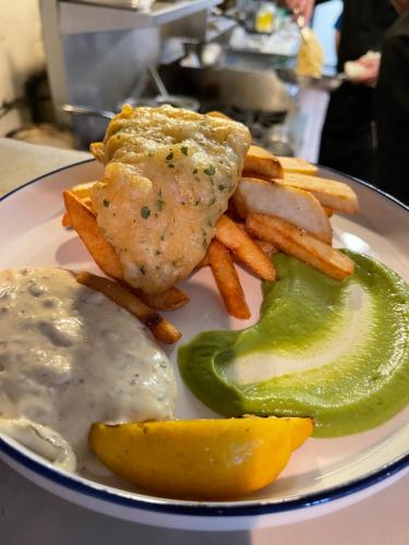 a plate of food with eggs and french fries and a lemon at Shannaghs Sweet Escape in Powell River