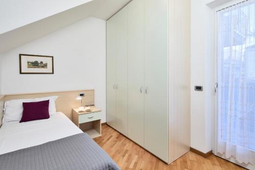 Katil atau katil-katil dalam bilik di Bella Villa Apartments
