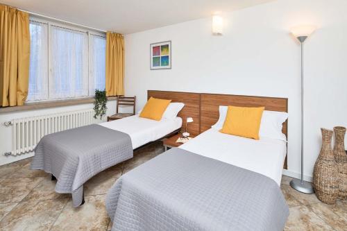 Katil atau katil-katil dalam bilik di Bella Villa Apartments