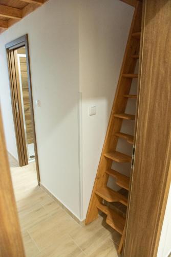 a staircase leading up to a room with white walls at Panská in Chlum u Třeboně